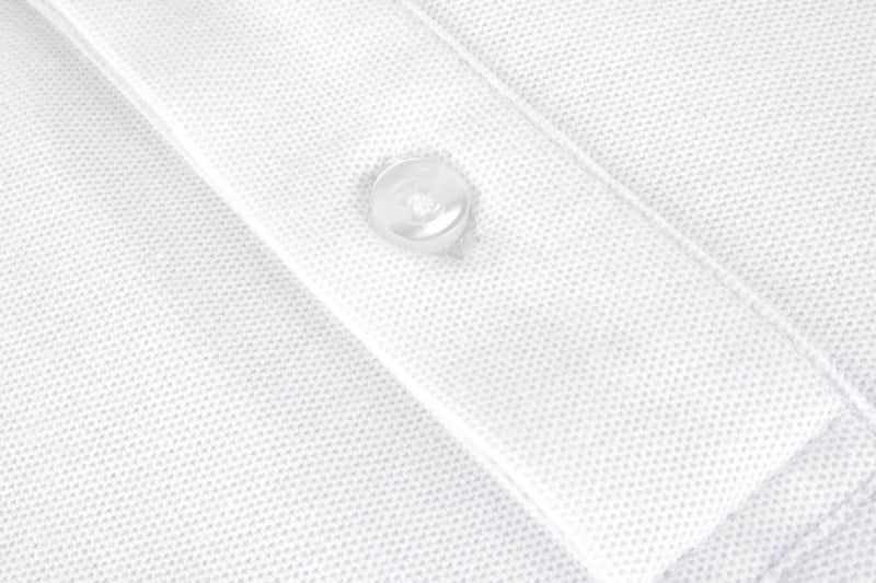 British menswear The Gent Wimbledon short sleeved polo shirt in white with navy Gent logo close up button view