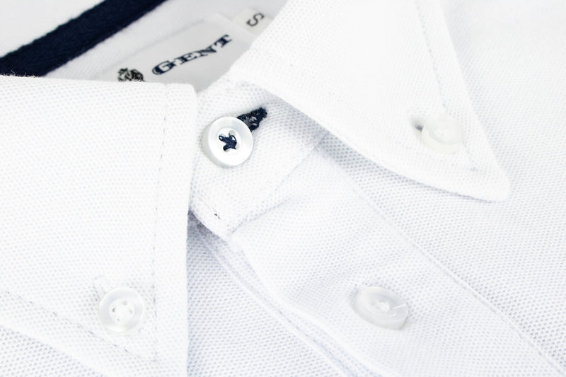 British menswear The Gent Wimbledon short sleeved polo shirt in white with navy Gent logo close up collar view